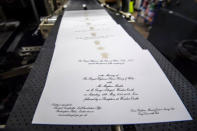 Invitations for Britain's Prince Harry and Meghan Markle's wedding in Windsor Castle in May, are seen after they have been printed at the workshop of Barnard and Westwood in London, March 22, 2018. Victoria Jones/Pool via Reuters