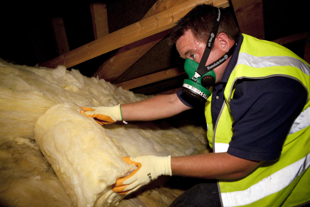 Illustrative image of loft insulation. A worker from Total Insulation Solutions lays insulating material in a loft. (Photo by: Newscast/Universal Images Group via Getty Images)