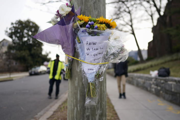 Flowers are attached to a pole as a memorial to Karon Blake in the Brookland neighborhood (Carolyn Kaster / AP)