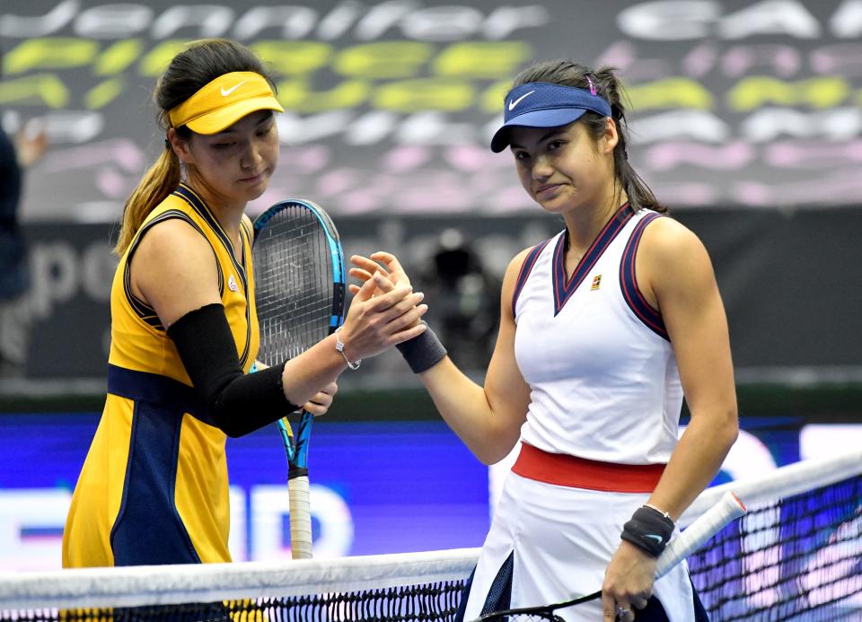 Pictured right, Britain's Emma Raducanu shakes hands with China's Wang Xinyu at the Linz Open in 2021.