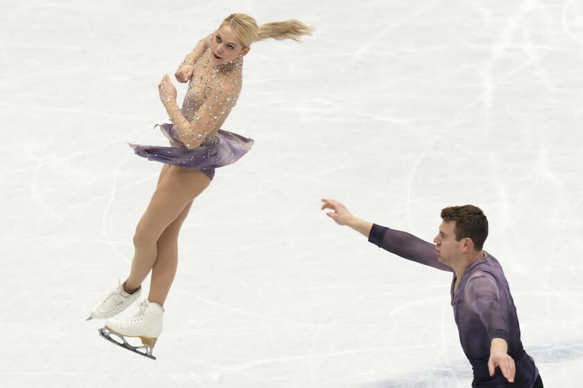 Alexa Knierim and Brandon Frazier, of the U.S, perform in the pairs free program.