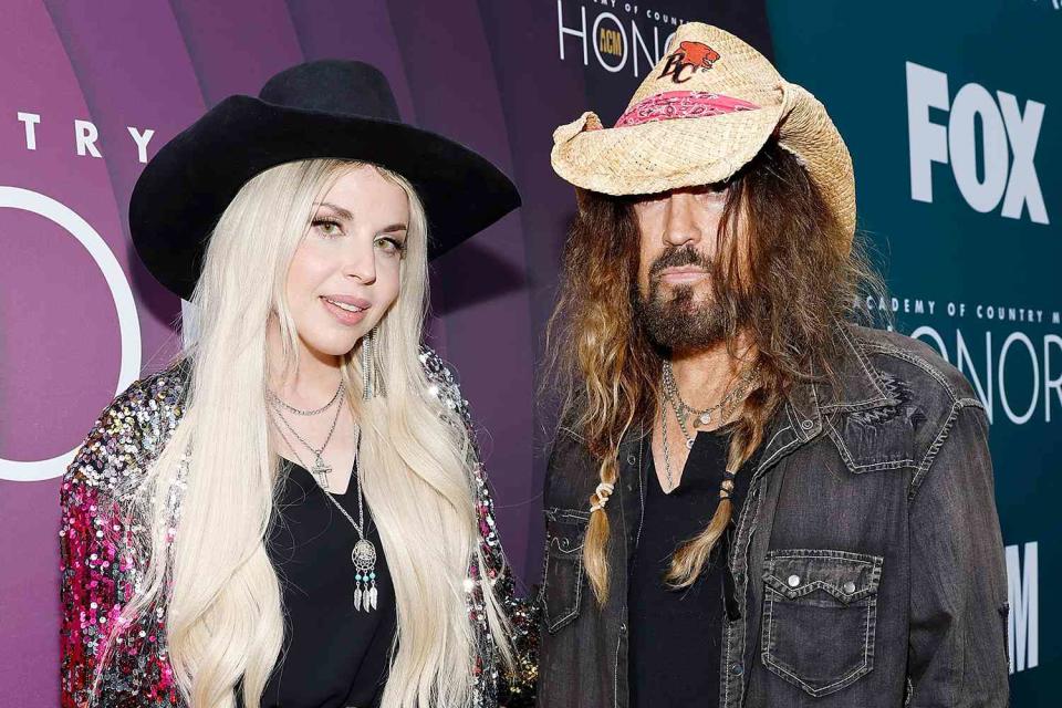 <p>Jason Kempin/Getty Images for ACM</p> Firerose and Billy Ray Cyrus in August 2023.