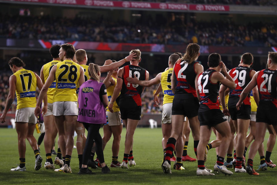 Richmond players congratulate Michael Hurley for kicking a goal in his final game.