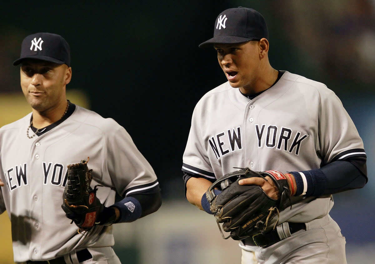 Alex Rodriguez and Derek Jeter running off the field together.