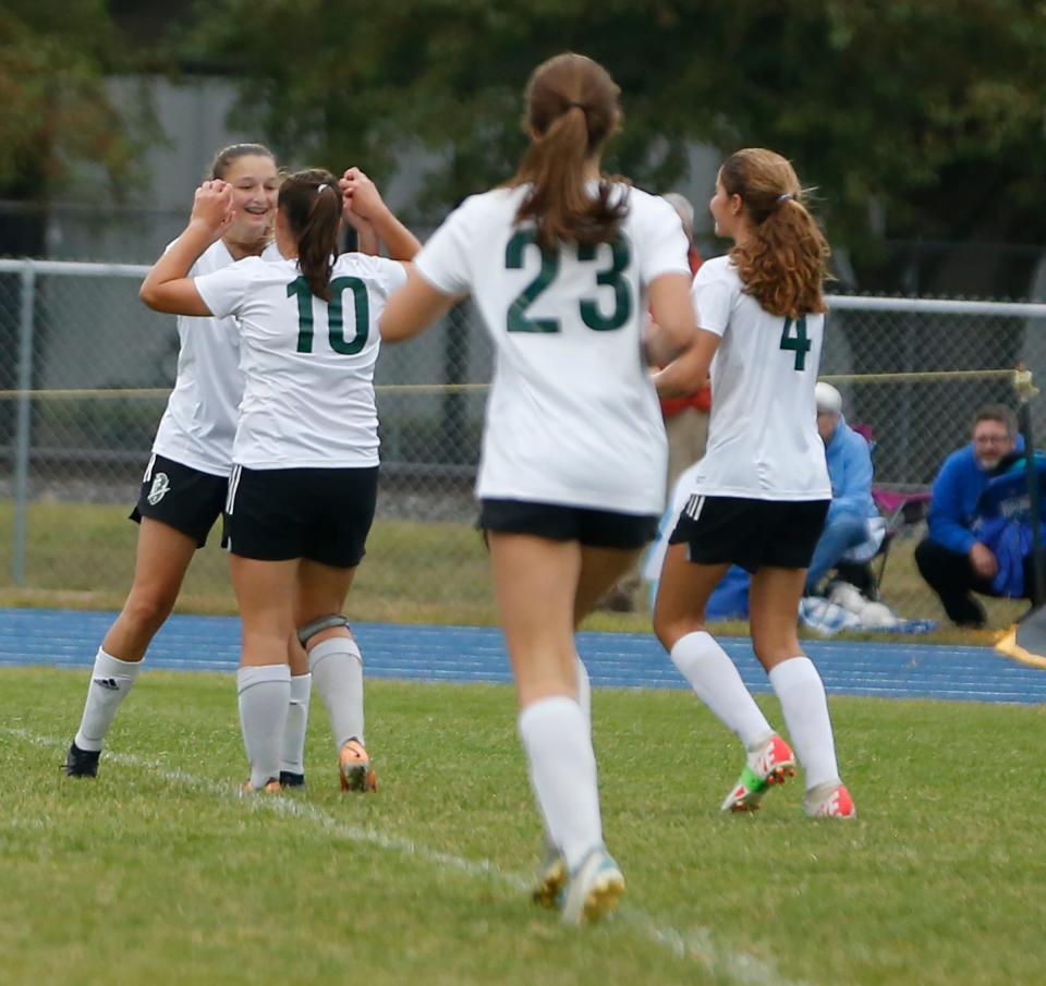 South Bend Trinity at Greenlawn players react after freshman Charis Gabrielse, left, scored during a game against Bethany Christian Tuesday, Sept. 19, 2023, at Bethany Christian High School in Goshen.