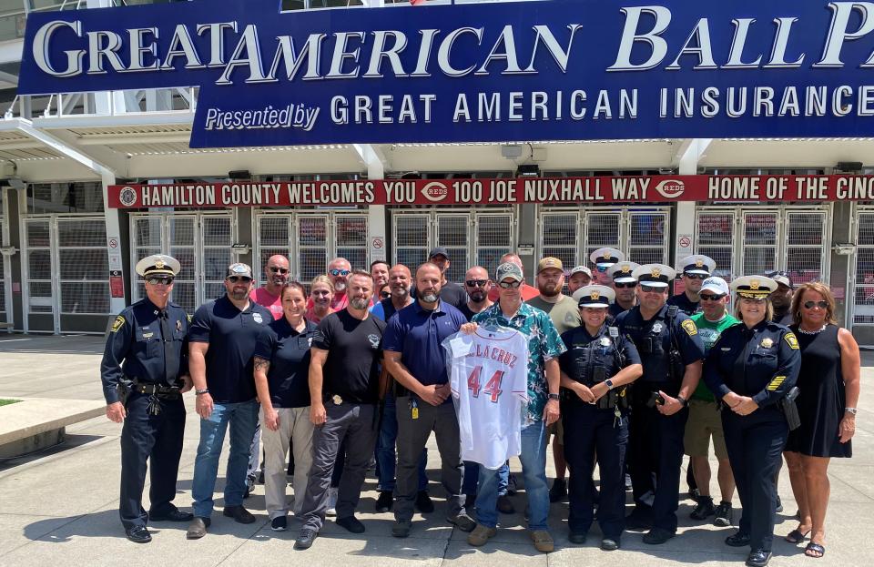 Cincinnati law enforcement officials send their regards - and a signed Cincinnati Reds Elly De La Cruz jersey - to Detective Lavar Gilbert.