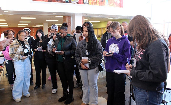 Students participate in a mock press conference during the Columbus Journalists in Training class.