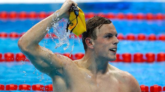 Kyle Chalmers celebrates gold in the 100m freestyle.