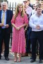 For her first public engagement, Carrie Symonds wowed in a £120 pink floral midi dress by British label, Ghost. Naturally, the dress sold out within minutes of her wearing it and Carrie even received the nod of approval from 'Good Morning Britain' presenter, Piers Morgan. <em>[Photo: Getty Images]</em>