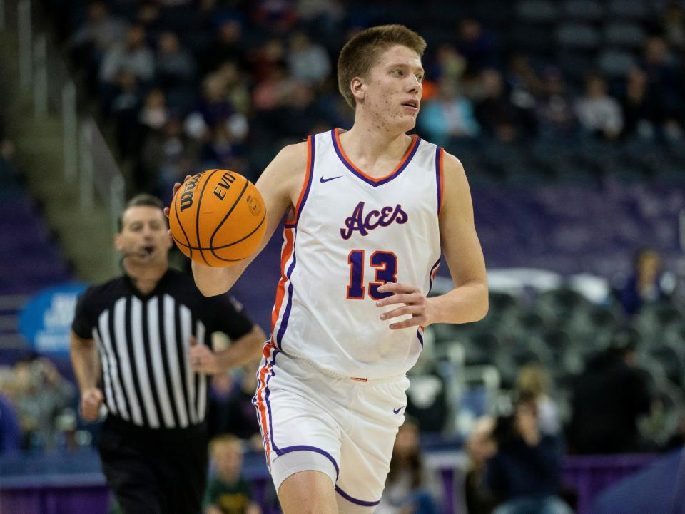 Evansville’s Ben Humrichous (13) dribbles up court as the University of Evansville Purple Aces play the Tennessee Tech Golden Eagles at Ford Center in Evansville, Ind., Wednesday, Dec. 20, 2023. Evansville won, 82-51.