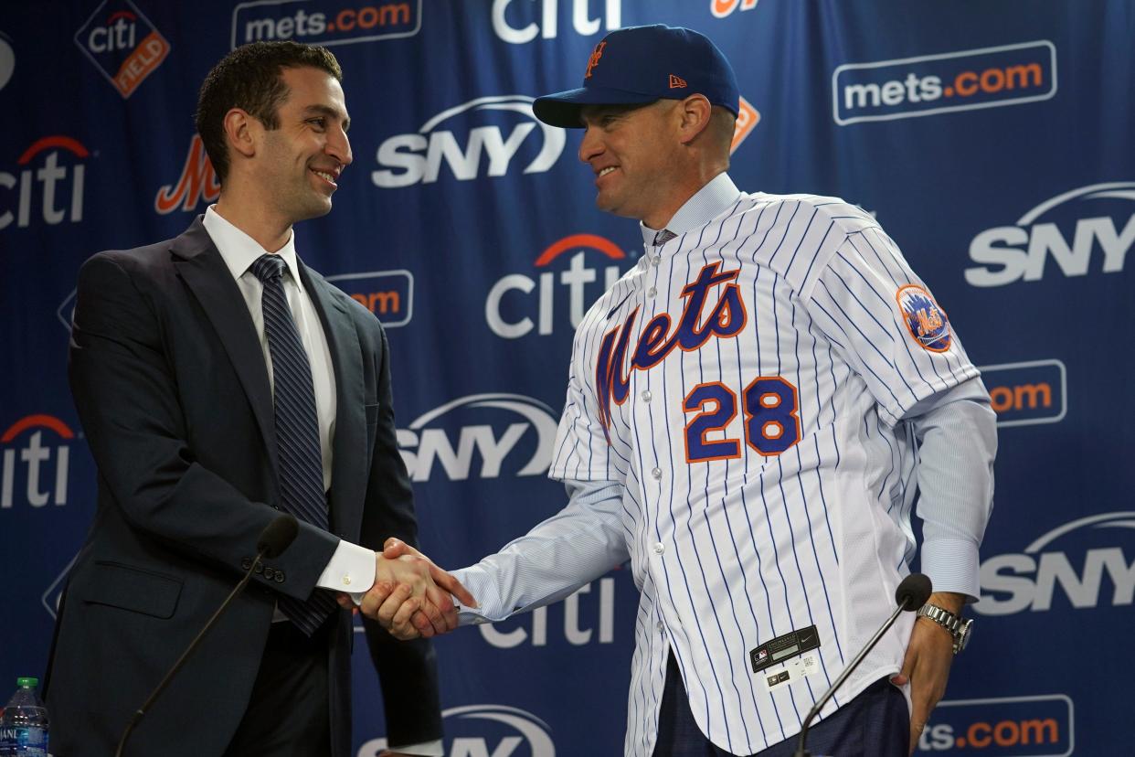 New York Mets president of baseball operations David Stearns, left, introduce new Mets manager, Carlos Mendoza, Tuesday, Nov. 14, 2023, at Citifield in New York. (AP Photo/Bebeto Matthews)