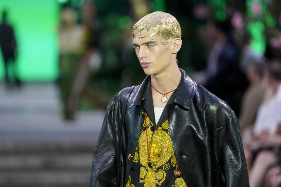 A model wears a creation as part of the Versace men's Spring Summer 2023 collection presented in Milan, Italy, Saturday, June 18, 2022. (AP Photo/Luca Bruno)