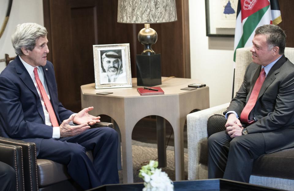 US Secretary of State John Kerry, Left, speaks with Jordan's King Abdullah II before a meeting at Al-Hummar Palace in Amman on Sunday, Jan. 5, 2014. America's top diplomat is trying to nudge the two closer to signing an accord, setting up a Palestinian state alongside Israel. Kerry said Saturday that progress is being made, yet key hurdles are yet to be overcome. Kerry's talks on Sunday with Jordan's King Abdullah II and Saudi Arabia's King Abdullah are likely to also touch on the war in Syria, rising violence in Iraq, and Iran's nuclear program. (AP Photo/Brendan Smialowski, Pool)