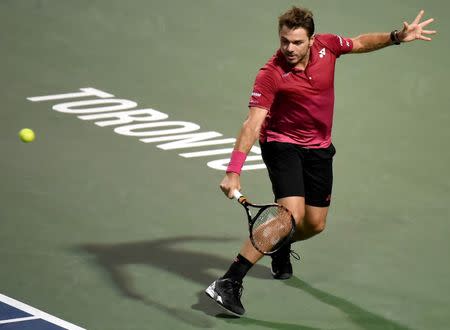 Jul 26, 2016; Toronto, Ontario, Canada; Stan Wawrinka of Switzerland hits a shot against Mikhail Youzhny of Russia on day two of the Rogers Cup tennis tournament at Aviva Centre. Mandatory Credit: Dan Hamilton-USA TODAY Sports