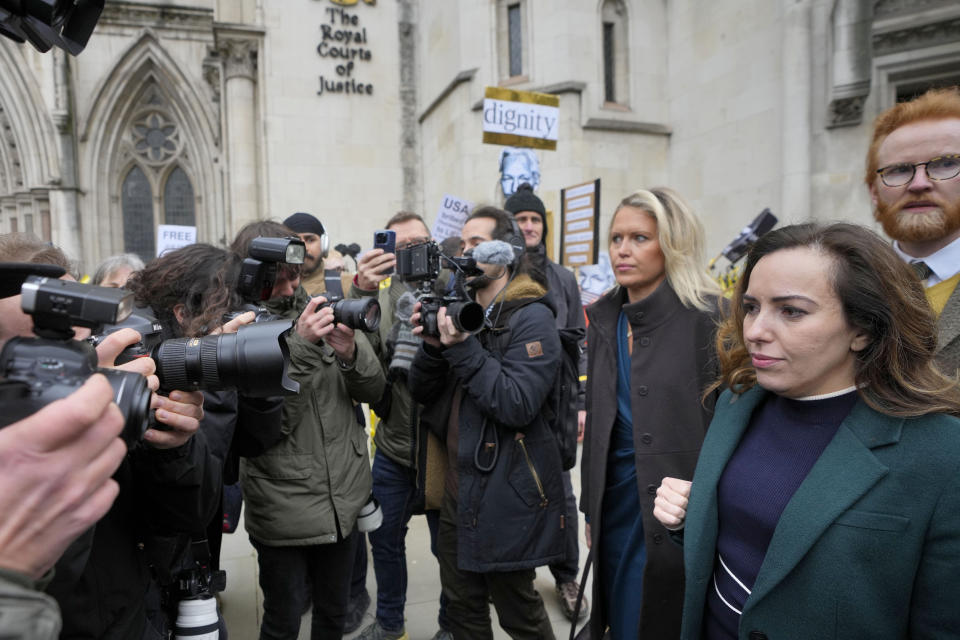 Stella Assange, right, wife of Julian Assange arrives at the Royal Courts of Justice in London, Tuesday, Feb. 20, 2024. WikiLeaks founder Julian Assange will make his final appeal against his impending extradition to the United States at the court. (AP Photo/Kirsty Wigglesworth)