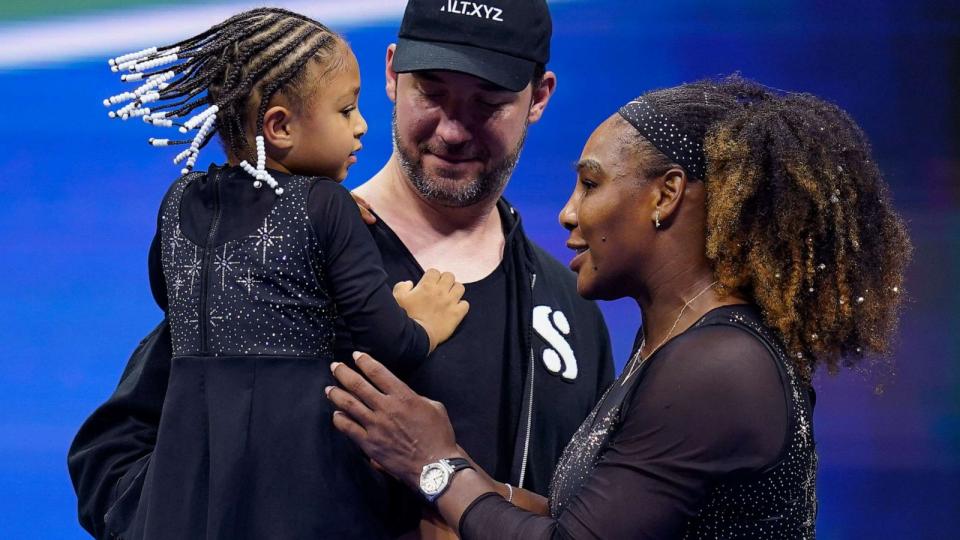 PHOTO: Serena Williams talks with her daughter Olympia and husband Alexis Ohanian after playing a match during the first round of the U.S. Open tennis championships, Aug. 29, 2022, in New York. (Charles Krupa/AP, FILE)