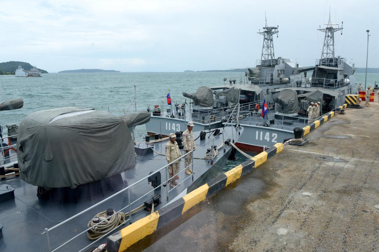 Cambodian naval personnel are seen on boats berthed at a jetty at the Ream naval base in Preah Sihanouk province on July 26, 2019 during a government organised media tour. - Cambodia on July 25 rubbished reports of a deal allowing China to use a naval base as "ill-intended" and aimed at inciting unrest in a country whose public is increasingly uneasy about Beijing's growing influence.