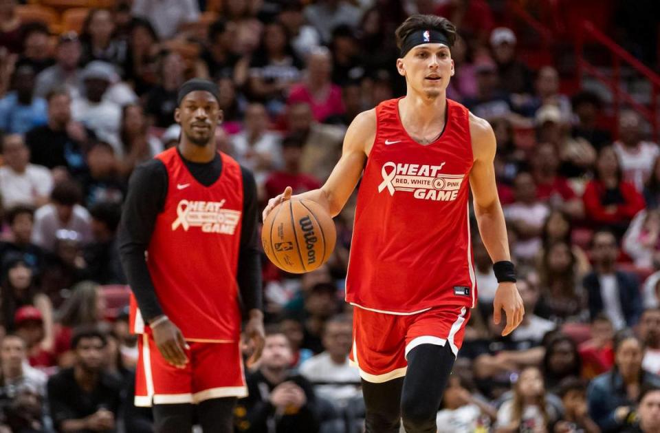 Miami Heat guard Tyler Herro (14) dribbles with the ball in the first half of the Heat Red, White & Pink intrasquad scrimmage game at the Kaseya Center on Monday, Oct. 9, 2023, in downtown Miami, Fla.