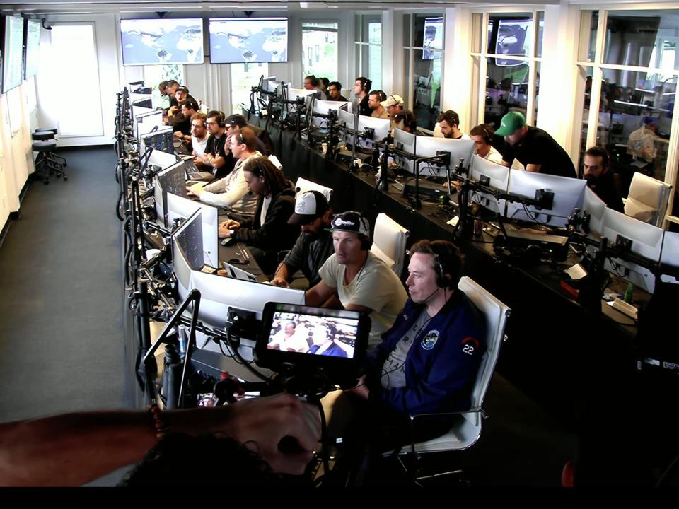 Elon Musk is seen in the SpaceX mission control as Starship blows up in the sky.