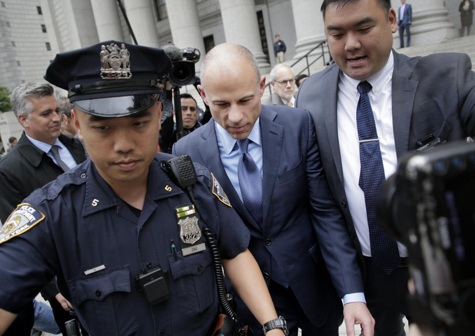 Attorney Michael Avenatti, center, leaves a courthouse in New York, Tuesday, May 28, 2019, after pleading not guilty to charges that he defrauded his most famous client, porn star Stormy Daniels. (AP Photo/Seth Wenig)