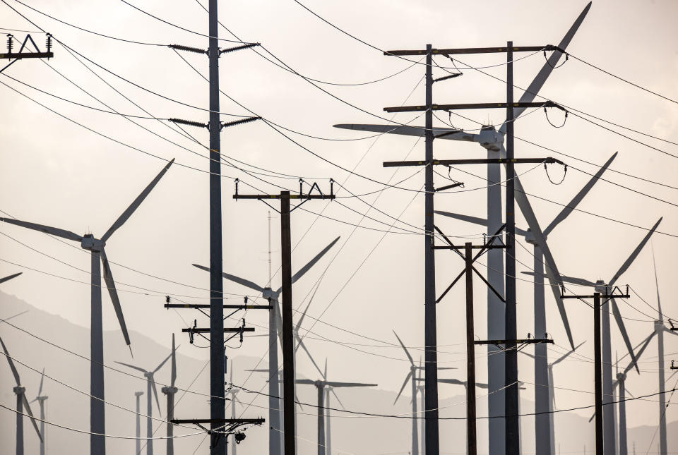 Electric power lines and wind turbines along Interstate 10 in Palm Springs, Calif.