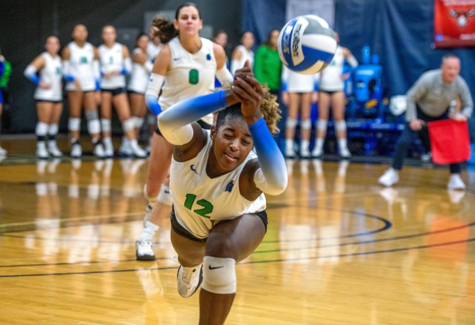 West Florida's Gabi Moulton (12) goes after the ball during the GSC Volleyball Championship game. West Florida wnet on to win the GSC Volleyball Championship game after sweeping Alabama Huntsville 3-0 at the University of West Florida Field House Sunday, November 19, 2023. It's UWF's sixth-consecutive GSC Championship.