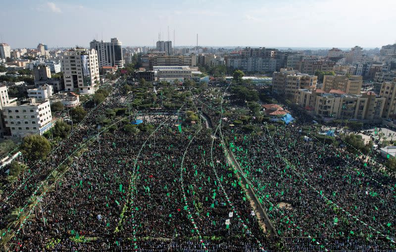 Palestinian Hamas supporters attend a rally marking the 35th anniversary of the movement founding, in Gaza City