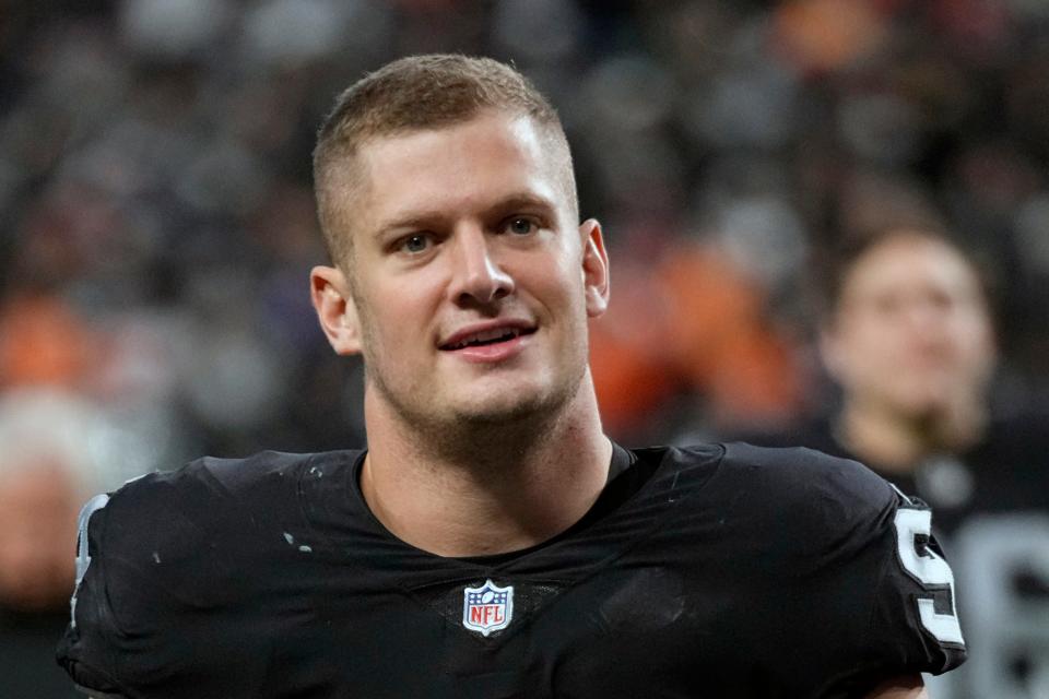 FILE - Las Vegas Raiders defensive end Carl Nassib (94) leaves the field after a victory over the Denver Broncos of an NFL football game, Sunday, Dec. 26, 2021, in Las Vegas. The Tampa Bay has signed outside linebacker Carl Nassib, who returns after playing for the Buccaneers in 2018 and 2019. Nassib joined the Buccaneers in Nashville, where they are practicing Wednesday, Aug. 17, 2022, and Thursday ahead of Saturday night's exhibition. (AP Photo/Jeff Bottari, File)