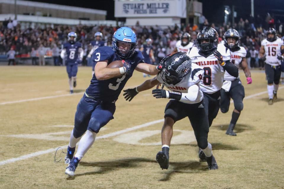 East Duplin's Avery Gaby runs past a Wallace-Rose Hill defender in a game last season.