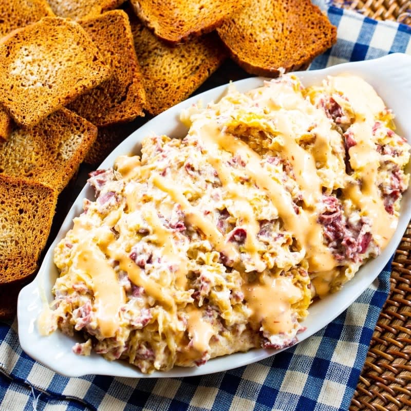 <p>Spicy Southern Kitchen</p><p>If you love a great Reuben sandwich, this dip just became the top dish at your football party.</p><p><strong>Get the recipe: <a href="https://spicysouthernkitchen.com/reuben-dip/" rel="nofollow noopener" target="_blank" data-ylk="slk:Slow Cooker Rueben Dip;elm:context_link;itc:0;sec:content-canvas" class="link rapid-noclick-resp">Slow Cooker Rueben Dip</a></strong></p>