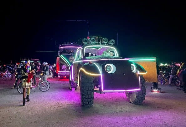 Attendees look at art cars during the annual Burning Man Festival on September 4, 2023 (AFP via Getty Images)