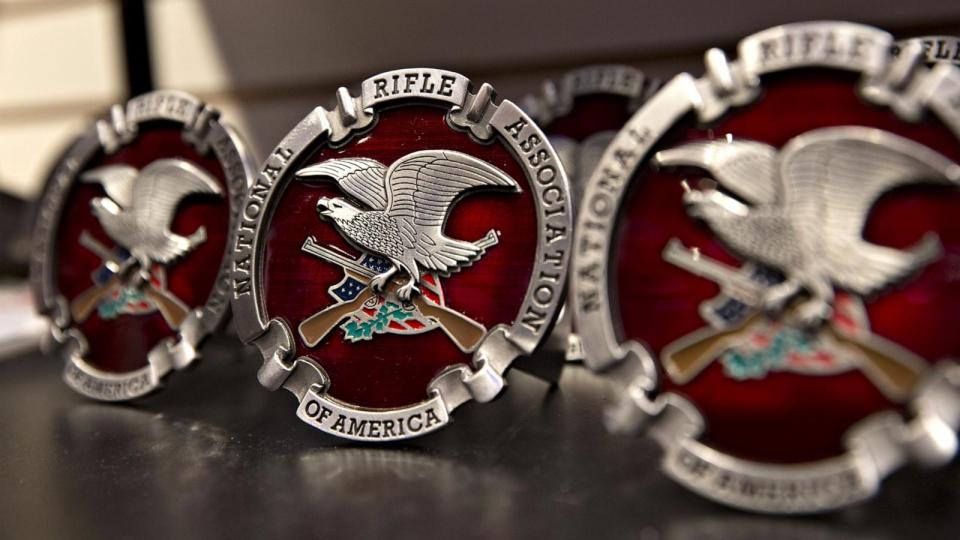 PHOTO: In this May 3, 2018, file photo, merchandise with the National Rifle Association logo is on display ahead of the NRA annual meeting in Dallas, Texas. (Bloomberg via Getty Images, FILE)