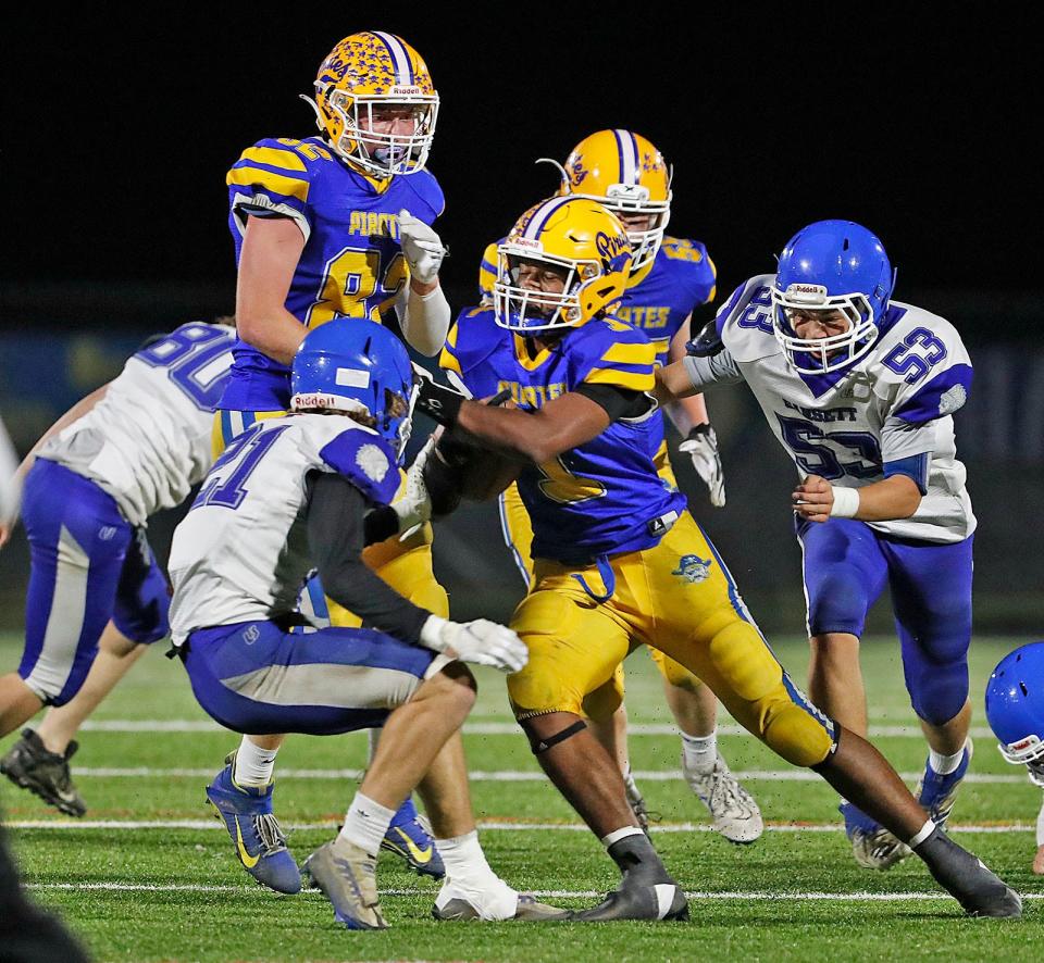 Pirate #1 captain Austin Bongo runs up the middle.The Hull Pirates play their first round in the MIAA tournament against the Narragansett Warriors at home on Friday November 4, 2022.