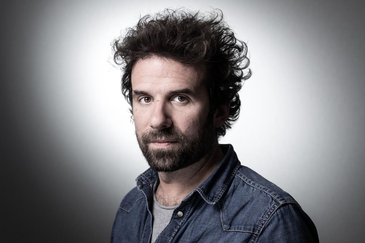 French writer and director Cyril Dion poses during a photo session at the Paris Book Fair 2019 (salon du livre) at the Parc des Expositions in Paris on March 15, 2019 in Paris. (Photo by JOEL SAGET / AFP)        (Photo credit should read JOEL SAGET/AFP via Getty Images)