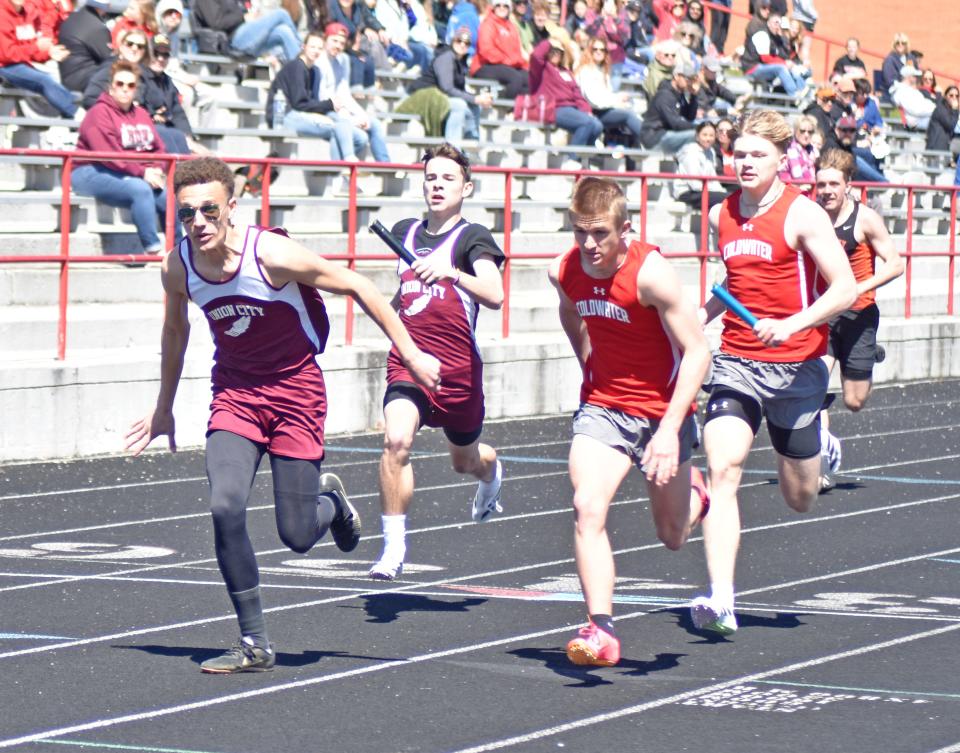 Coldwater and Union City are neck-and-neck at the second hand off of the 800 meter relay. Union City went on to win the event.