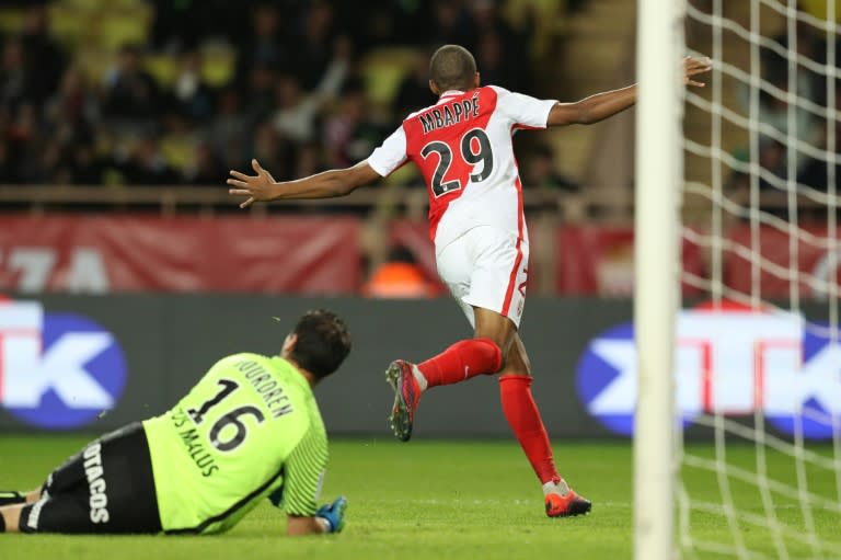 Monaco's Kylian Mbappe Lottin celebrates after scoring a goal during the match against Montpellier at the Louis II Stadium in Monaco on October 21, 2016