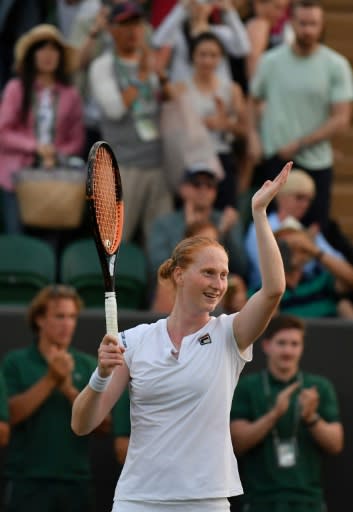 Stunning win: Alison Van Uytvanck celebrates winning against Garbine Muguruza