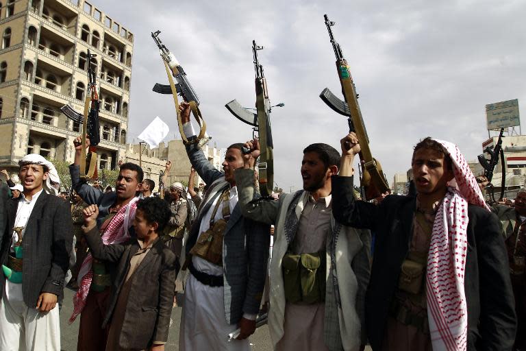 Yemeni supporters of the Shiite Huthi movement raise their weapons during a rally in the capital Sanaa on July 5, 2015, protesting against air strikes by a Saudi-led coalition