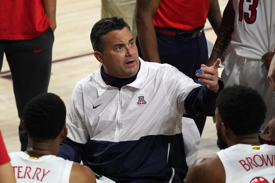 Arizona coach Sean Miller talks to the team during a timeout in the first half of the team's NCAA college basketball game against Arizona State, Thursday, Jan. 21, 2021, in Tempe, Ariz. (AP Photo/Rick Scuteri)