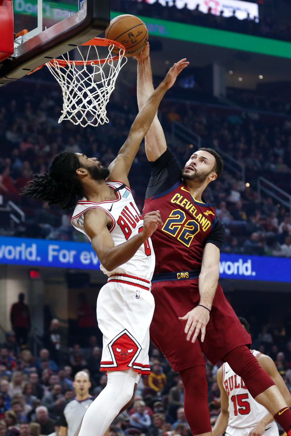 Cleveland Cavaliers' Larry Nance Jr. (22) dunks against Chicago Bulls' Coby White (0) in the first half of an NBA basketball game, Saturday, Jan. 25, 2020, in Cleveland. (AP Photo/Ron Schwane)