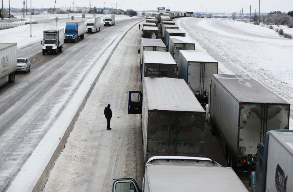 Hundreds of trucks at a standstill on a snowy highway