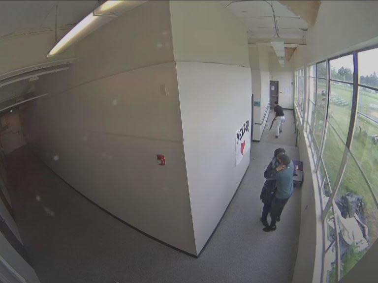 Keanon Lowe took the gun off student Angel Granados-Diaz in the classroom and then hugged and consoled him (pictured): Parkrose Security Video