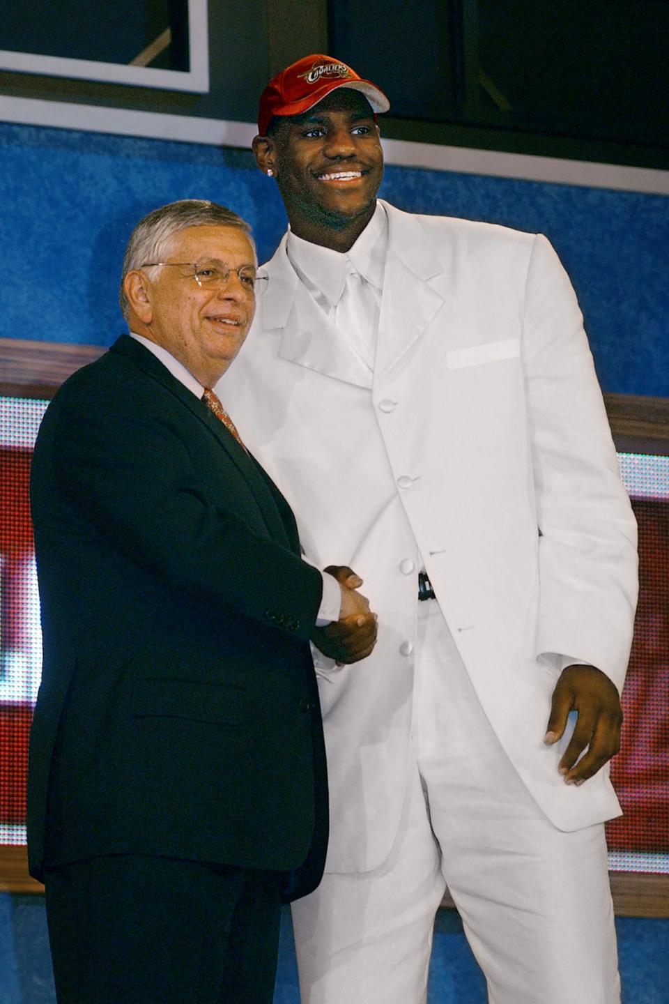 Former NBA Commissioner David Stern shakes hands with LeBron James after he was chosen by the Cleveland Cavaliers with the first pick of the 2003 NBA Draft on June 26, 2003, in New York.