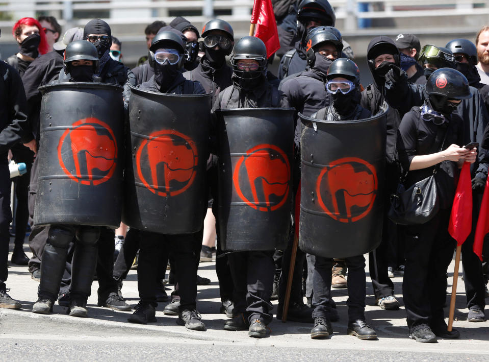 <p>Counterprotesters gather across the street from right-wing supporters of the Patriot Prayer group during a rally in Portland, Ore., Aug. 4, 2018. (Photo: Jim Urquhart/Reuters) </p>