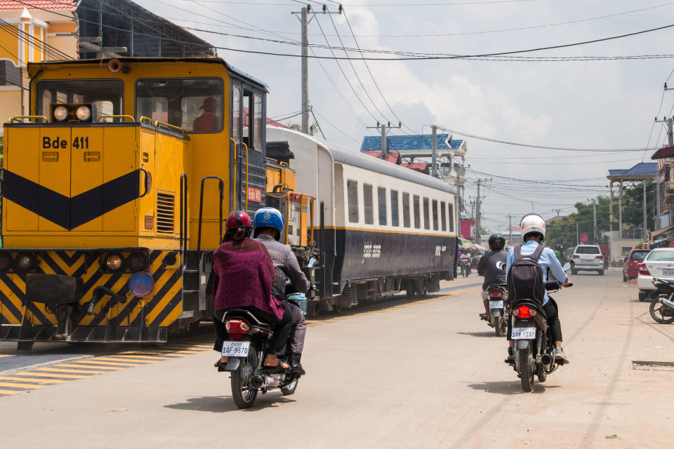Road space is at a premium as the train shuttles to the airport in Phnom Penh.