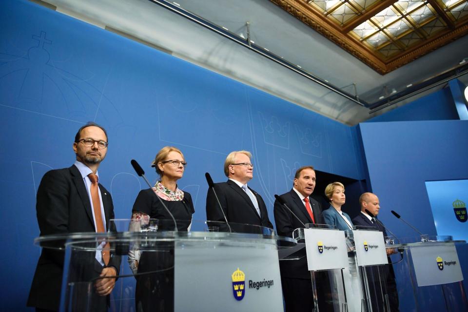 (L-R) Sweden's Minister for Infrastructure Tomas Eneroth, Minister for Migration, Helene Fritzon, Minister of Defence Peter Hultqvist, Prime minister Stefan Lofven, Minister for Social Security Annika Strandhall and Minister for Home Affairs and Justice Morgan Johansson attend a press conference at Rosenbad, the Swedish government headquarters, in Stockholm on July 27, 2017: AFP/Getty