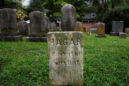 A grave stone reading "Hagar Faithful Servant," according to the local government the grave of a domestic servant or slave of R.K. Meade named Newton Hagar, stands in Maplewood Cemetery, ahead the one-year anniversary of the fatal white-nationalist rally, in Charlottesville, Virginia, U.S., August 1, 2018. REUTERS/Brian Snyder