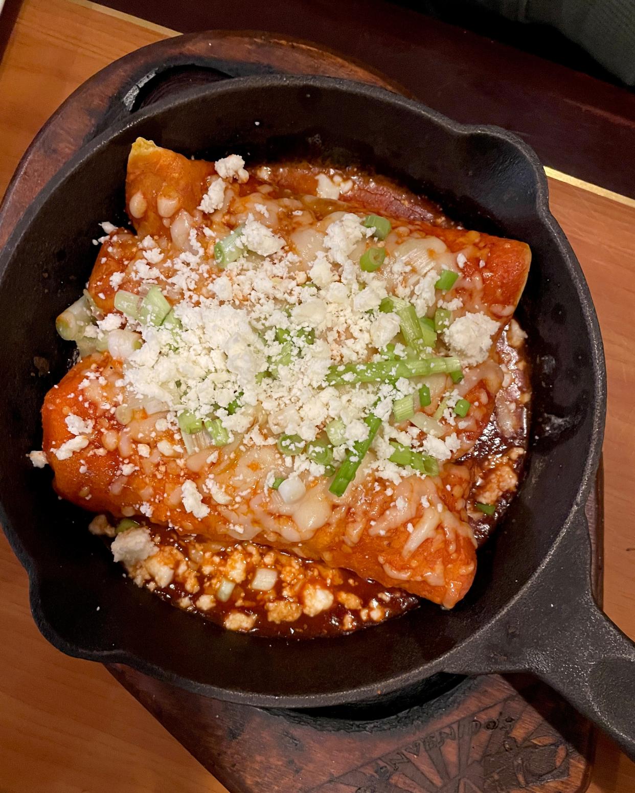 The enchiladas cazerola Mexicana includes three enchiladas (with shredded chicken, pork, beef, cheese or beans inside) with red sauce, sour cream, green onions and guacamole. It’s served with a plate of rice on the side.