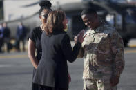 U.S. Vice President Kamala Harris, center, speaks with a U.S. military member after arriving at Yokota Air Base on the outskirts of Tokyo Monday, Sept. 26, 2022. (Leah Millis/Pool Photo via AP)