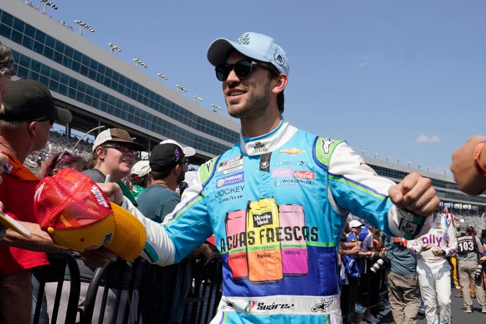 Daniel Suarez walks during driver introductions before the NASCAR Cup Series auto race at Texas Motor Speedway in Fort Worth, Texas, Sunday, Sept. 25, 2022. (AP Photo/LM Otero)